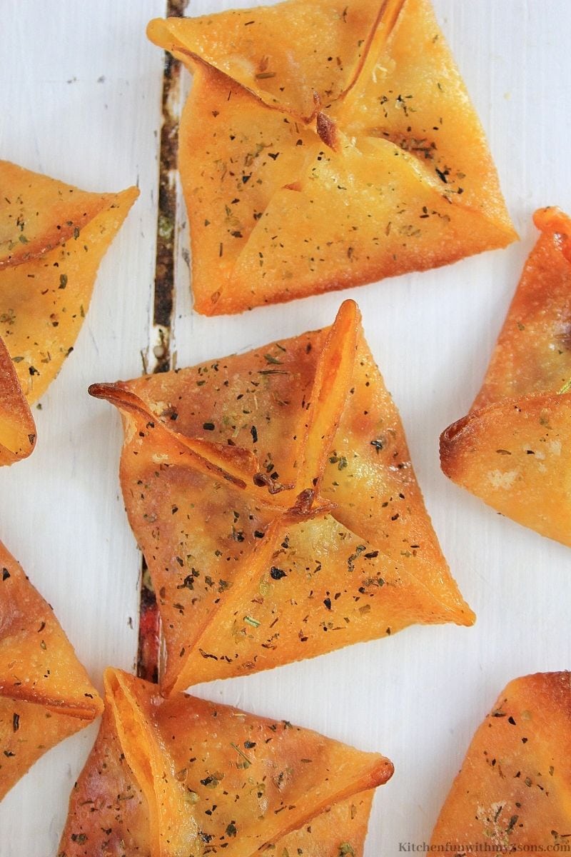 Easy Pepperoni Pizza Wontons Snack on a white wooden table.