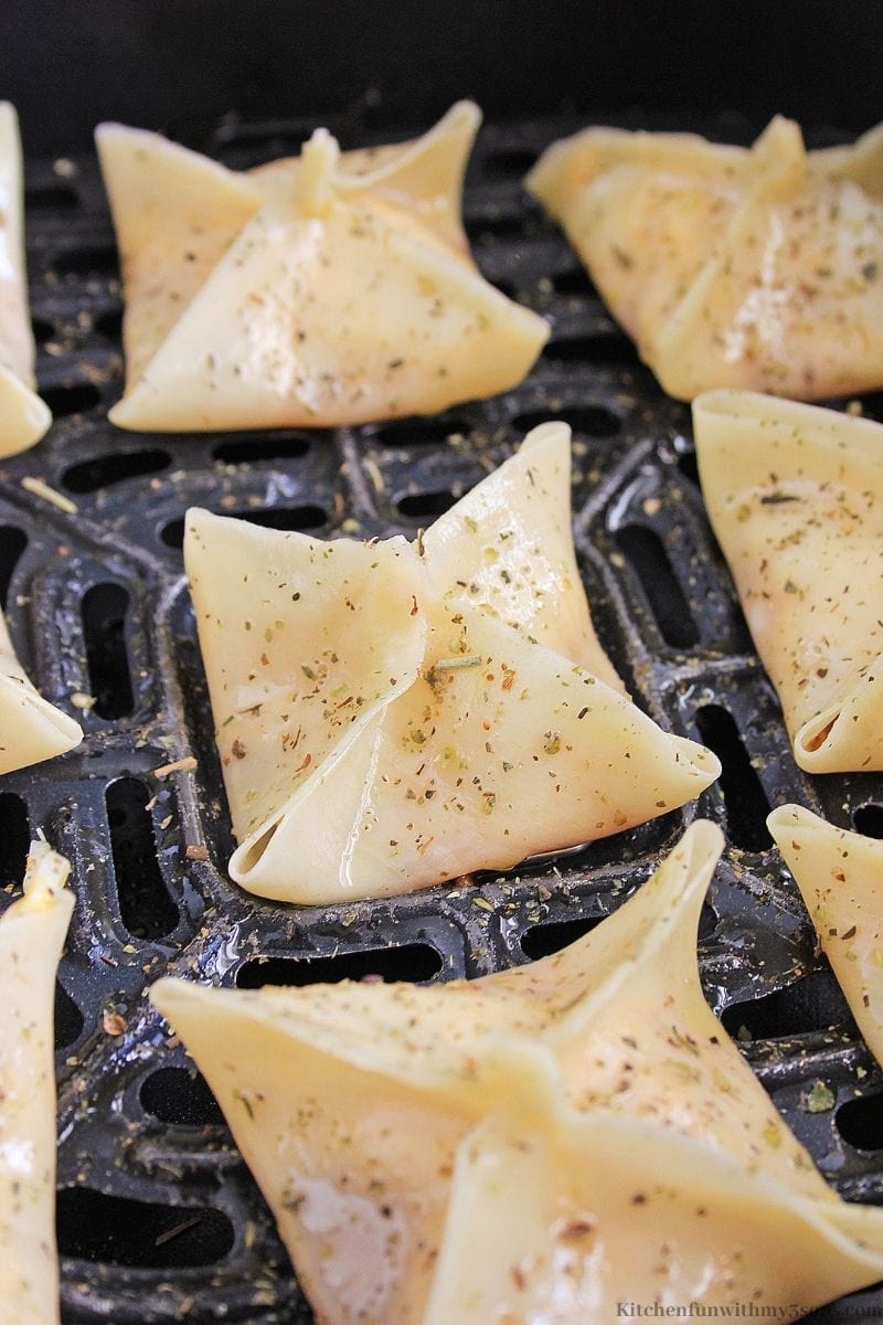 Your prepared wontons into the air fryer.