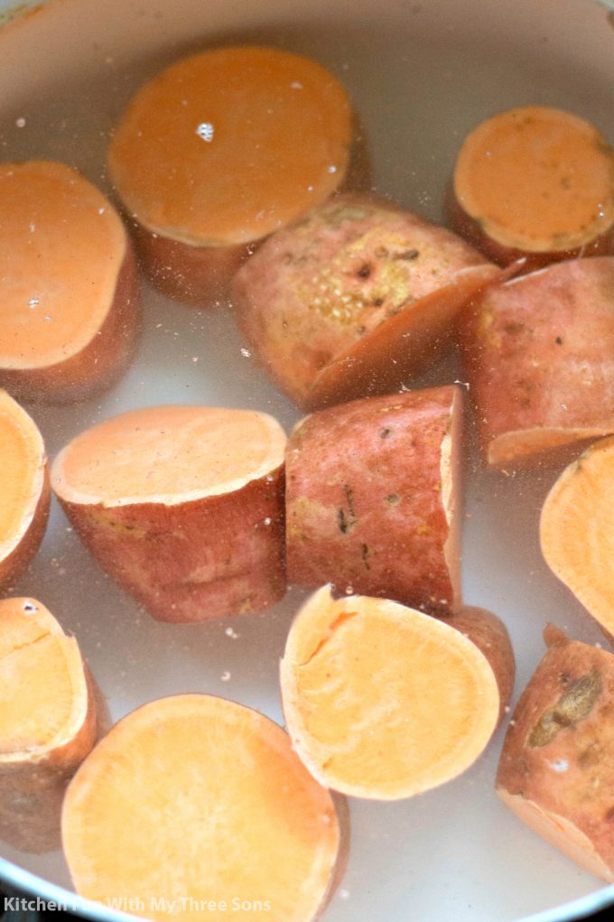 boiling sweet potatoes in a pot of water