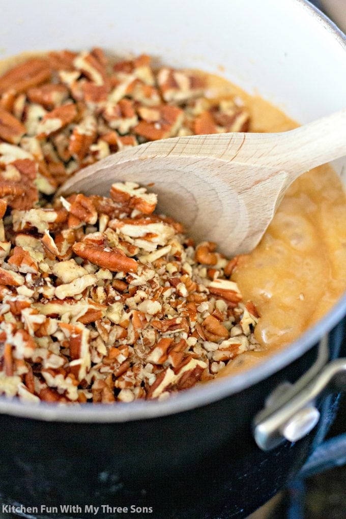 mixing pecans into toffee