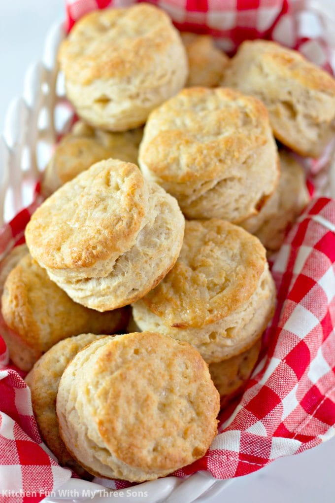Honey Butter Biscuits in a basket with a red and white napkin