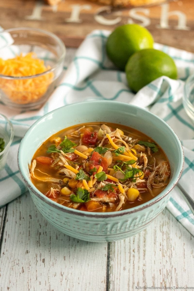 Instant Pot Chili Lime Chicken Soup Recipe with a patterned blue cloth around it.