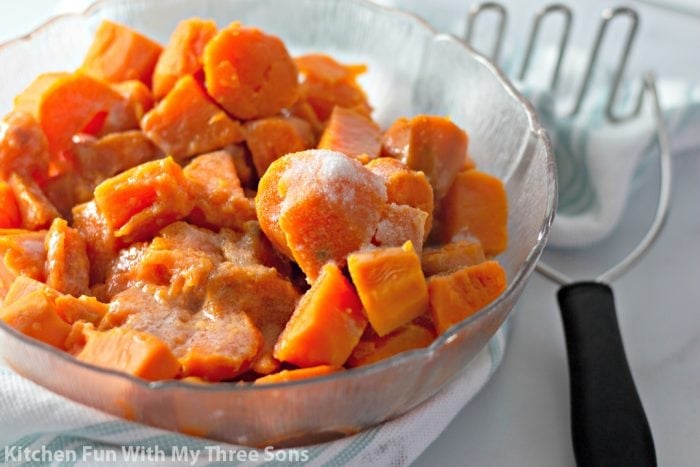 Chunks of sweet potatoes topped with salt in a bowl