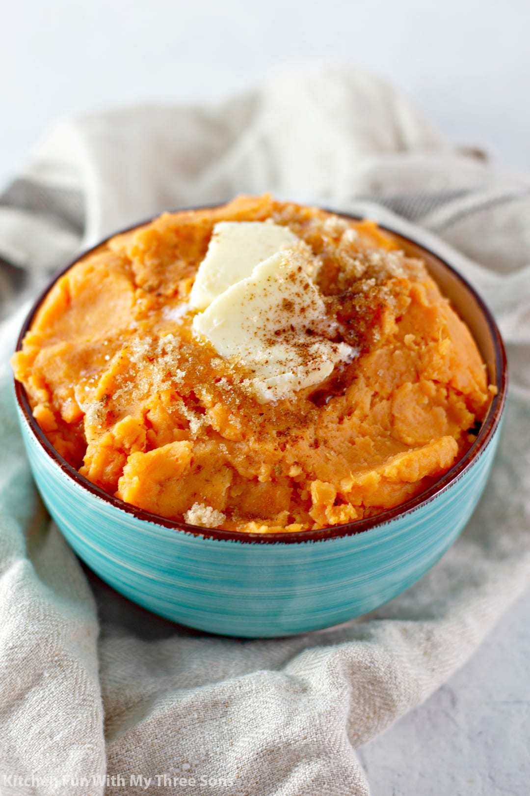 Mashed Sweet Potatoes with butter, brown sugar, and cinnamon on top