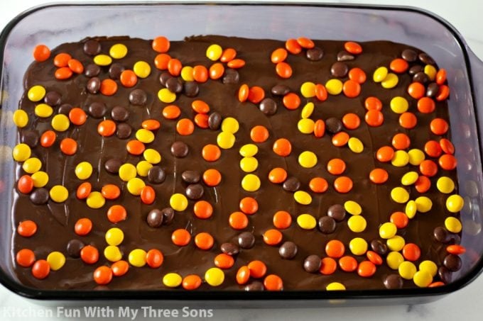sprinkling Reese's Pieces over the bars
