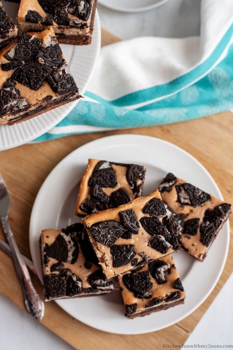 Oreo Brownie Cheesecake Bars Recipe on a serving plate.