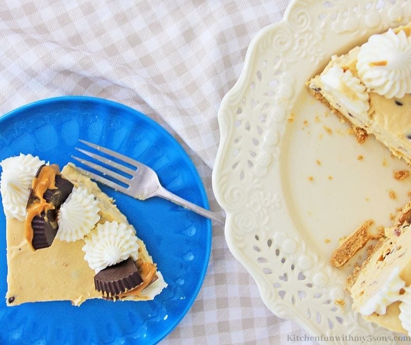 Peanut Butter Chocolate Chip Cheesecake Recipe on a serving plate with a fork.