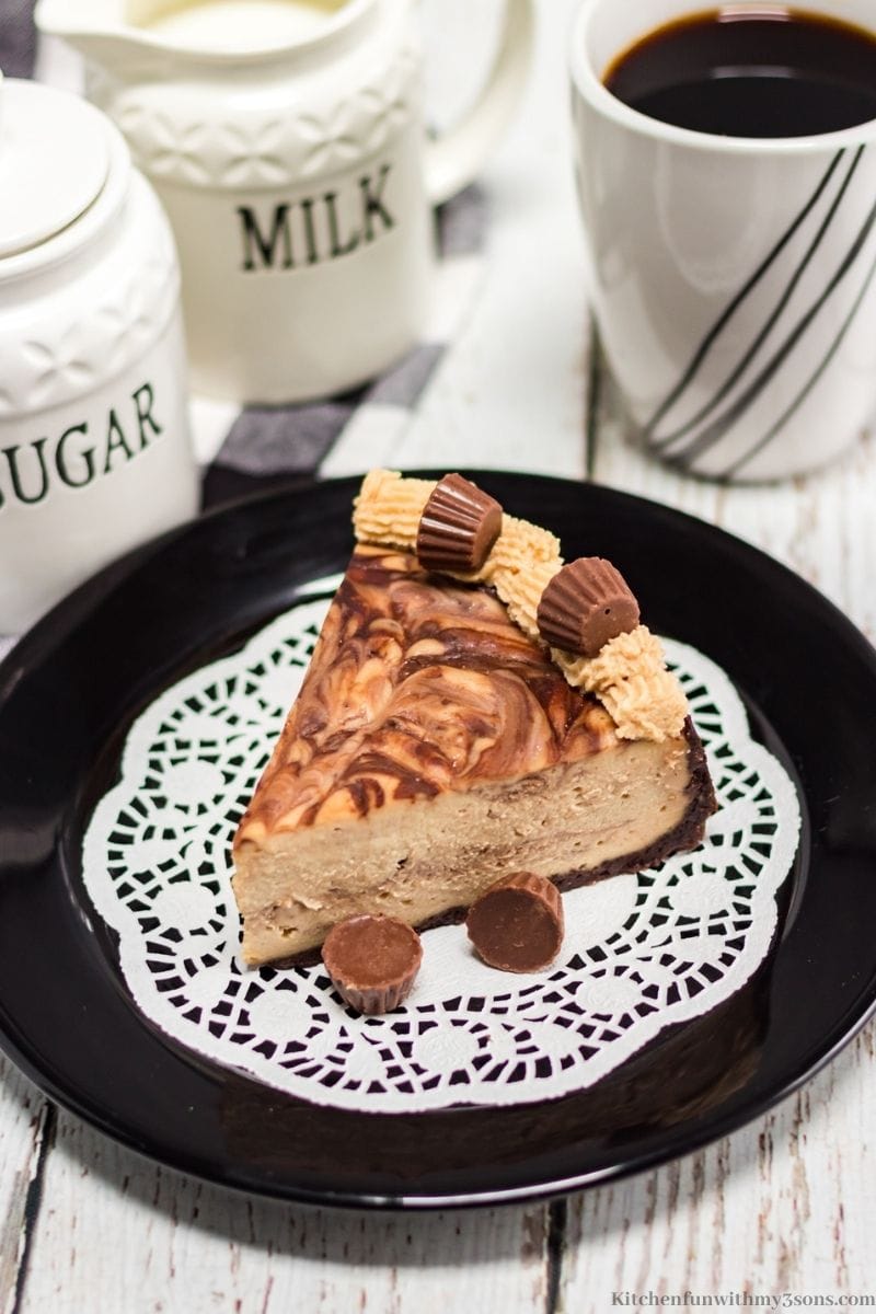 Instant Pot Chocolate Peanut Butter Cheesecake with milk sugar and coffee beside it.