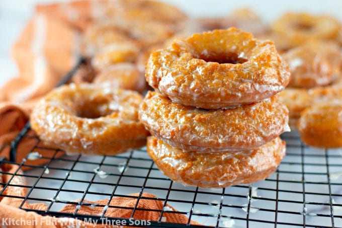 Pumpkin Spice Buttermilk Donuts on a wire cooling rack