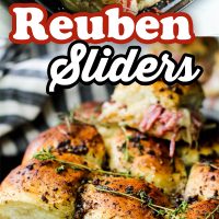 Reuben sliders on a plate with shredded corned beef.
