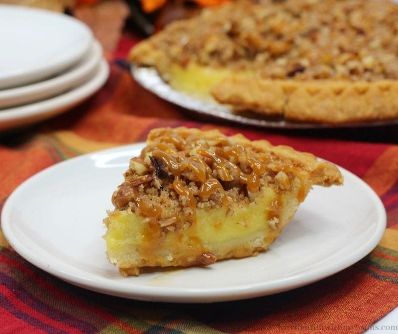 Streusel Buttermilk Pie Recipe with fall decorations behind it.
