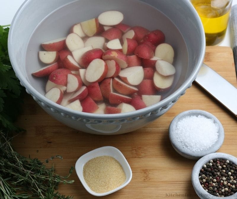 Your chopped red potatoes in a water bath.