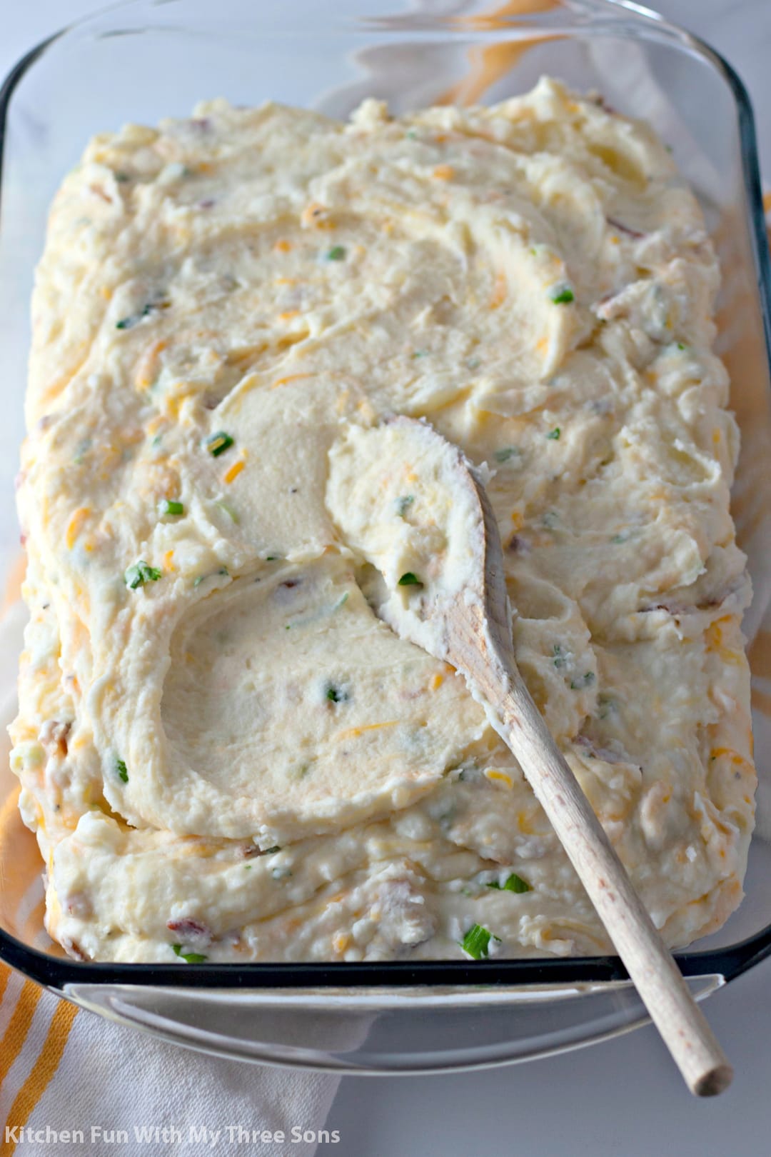 Loaded mashed potatoes spread in a glass baking dish