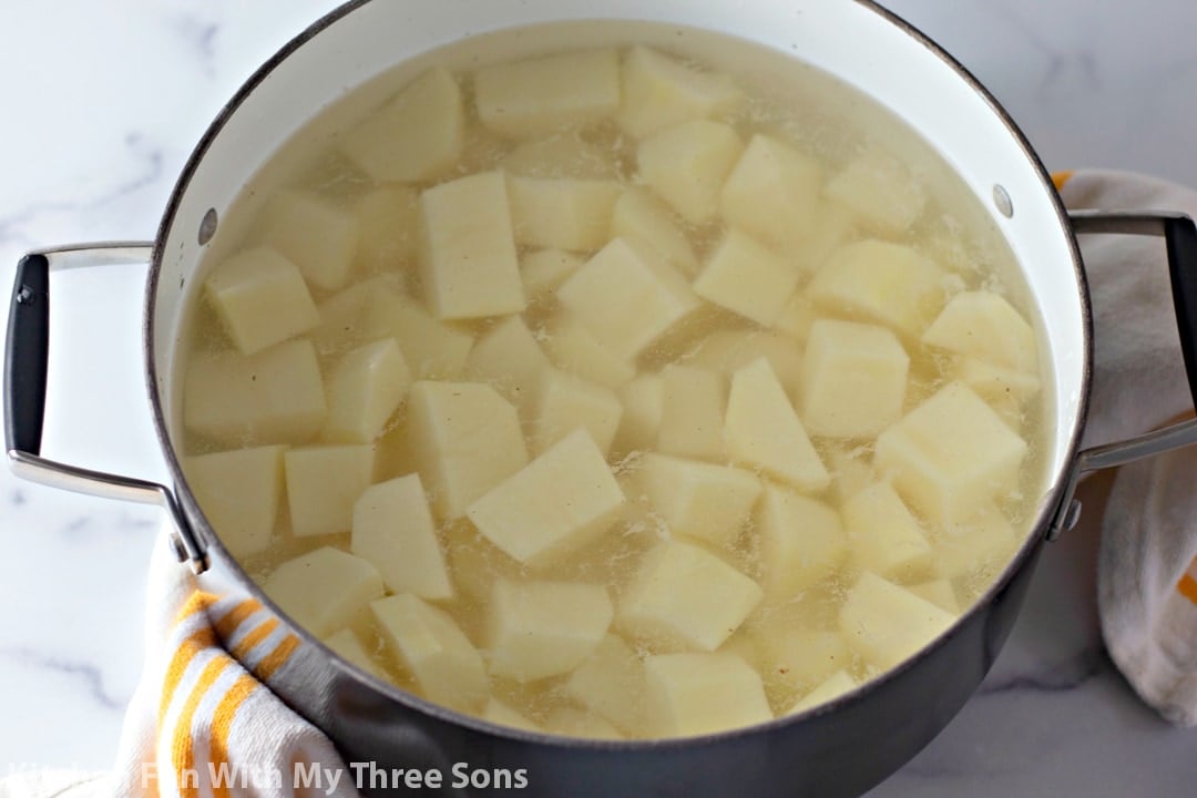 Chunks of potatoes boiling in water