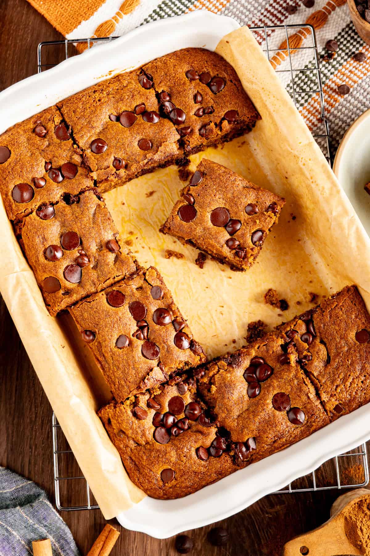 These Pumpkin Chocolate Chip Bars are soft, moist, and packed with cozy Fall flavor and melty chocolate chips! Pumpkin Chocolate Chip Bars in a pan