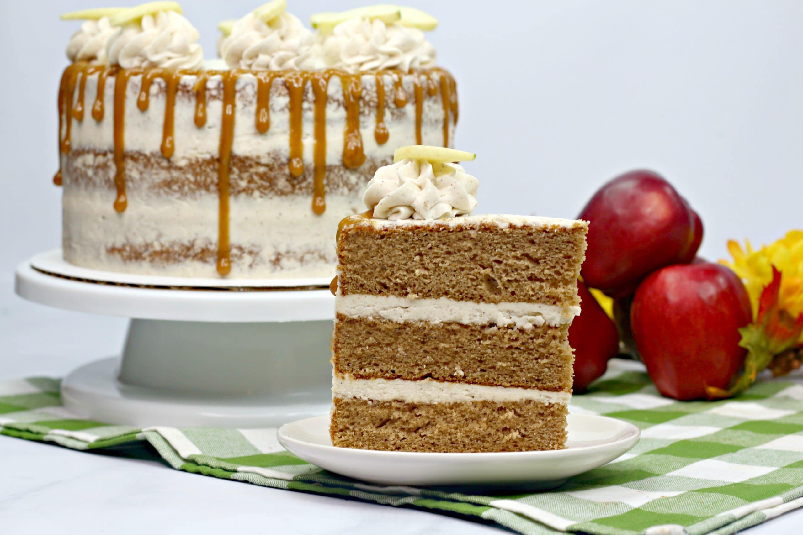 slice of layered apple spice cake on a white plate
