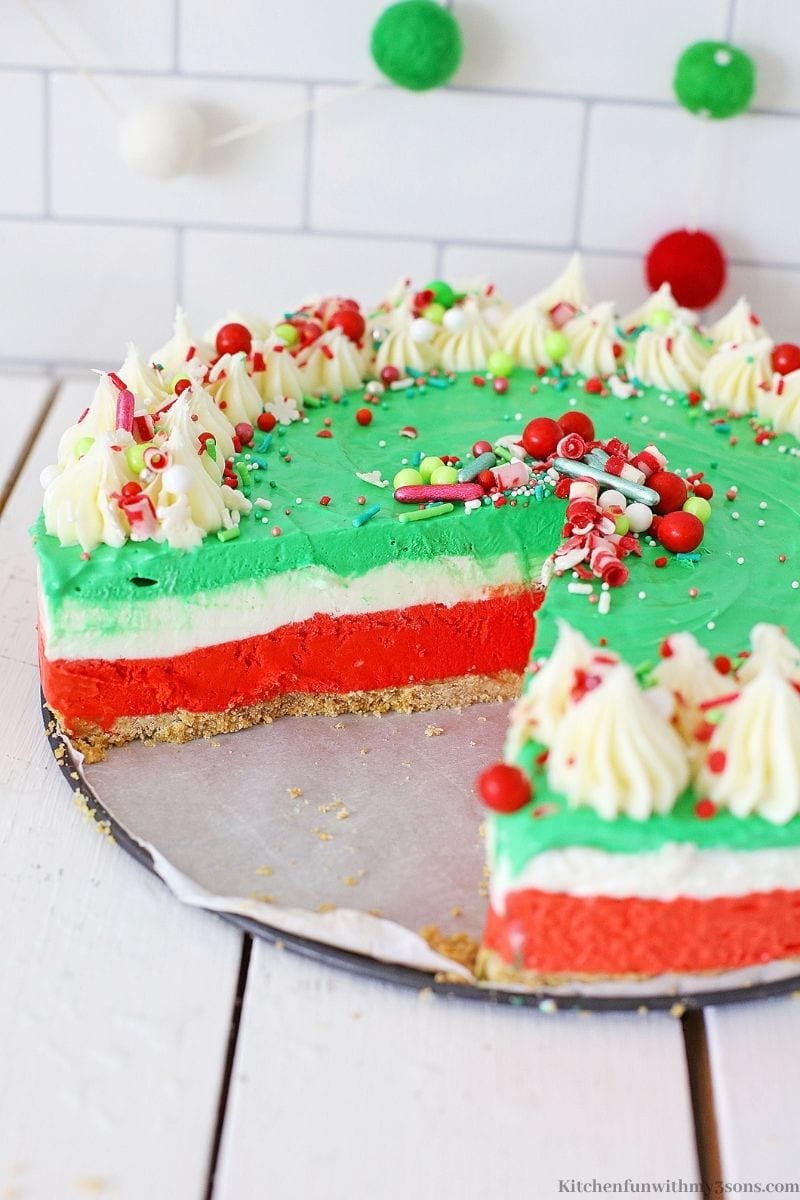 The Christmas No Bake Cheesecake with a slice taken out of it.