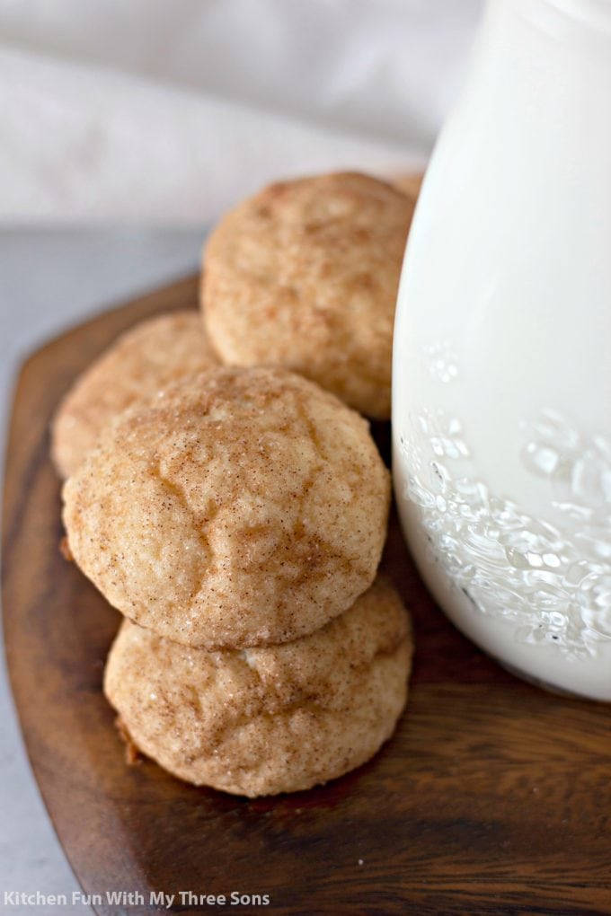 stacked Cinnamon Cream Cheese Cookie Puffs next to a jar of milk