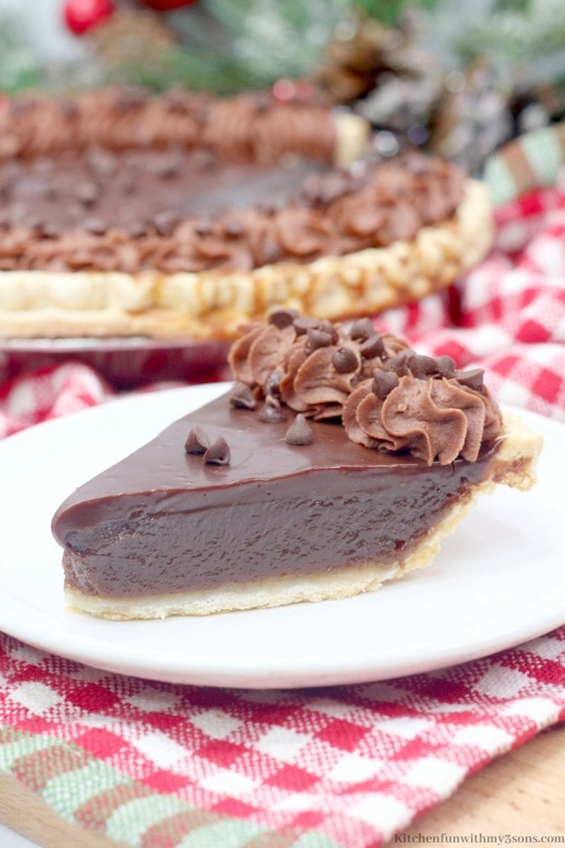 Decadent Chocolate Buttermilk Pie on a white and red checkered cloth.