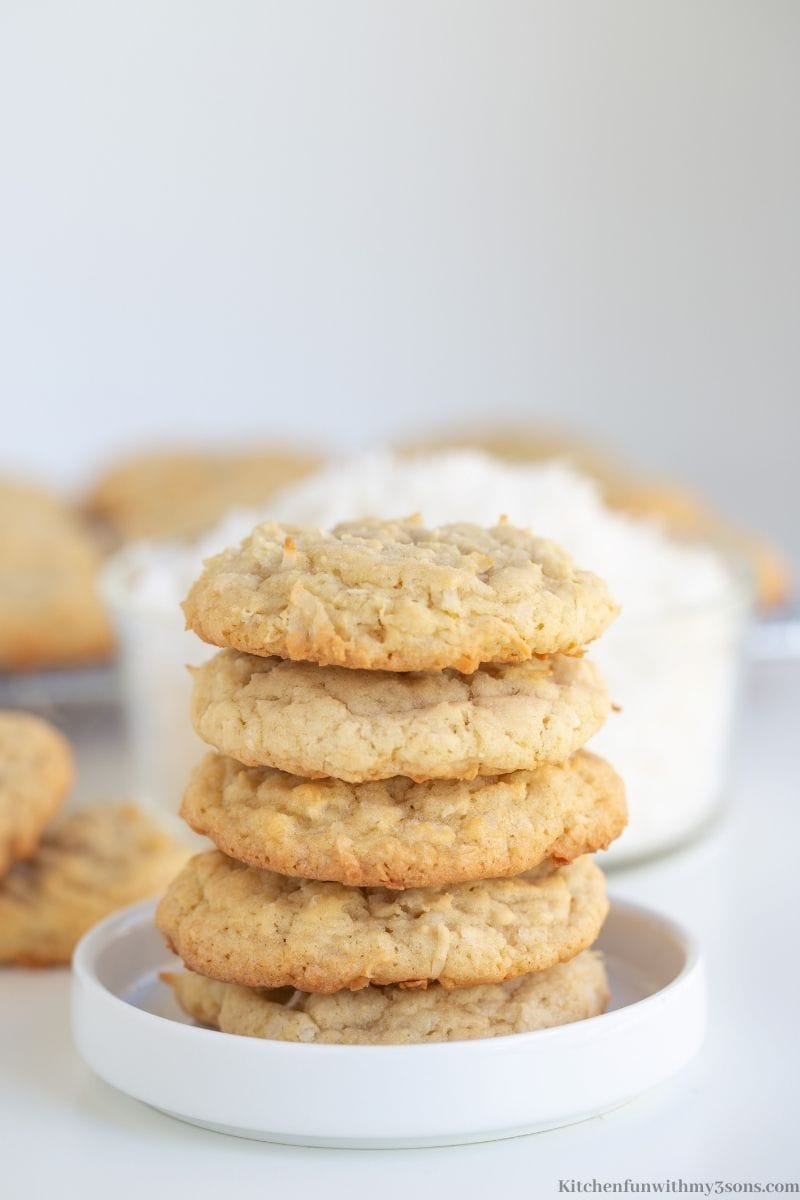 Easy Coconut Cookies stacked on top of each other.