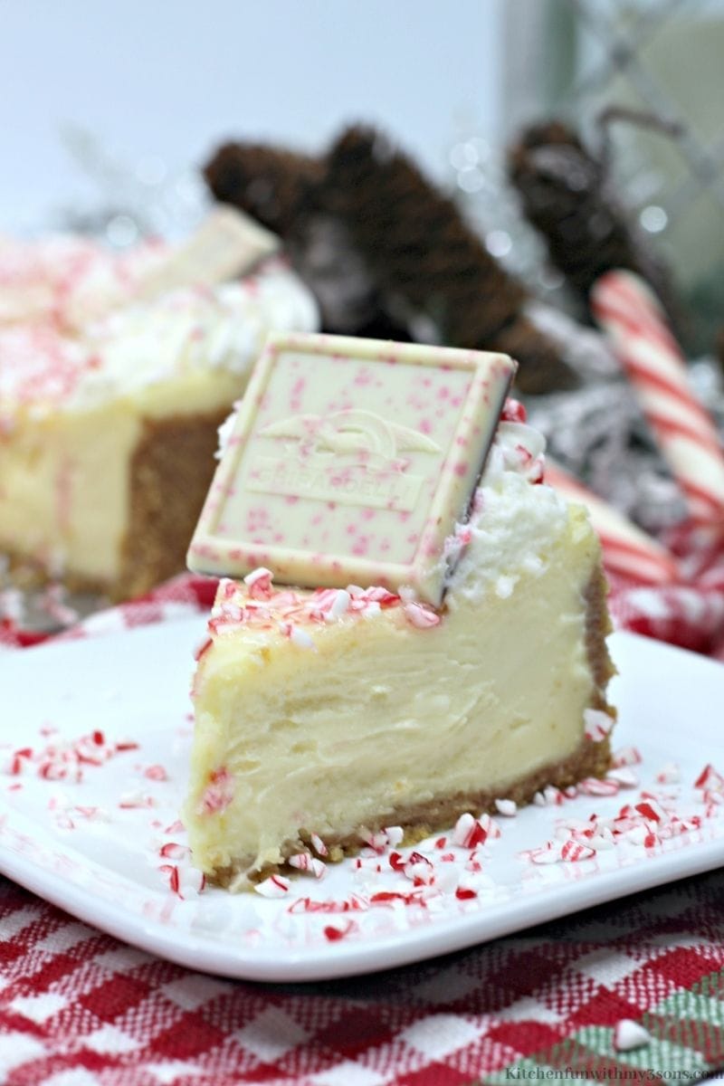 Ghirardelli Peppermint Cheesecake Recipe on a patterned cloth.