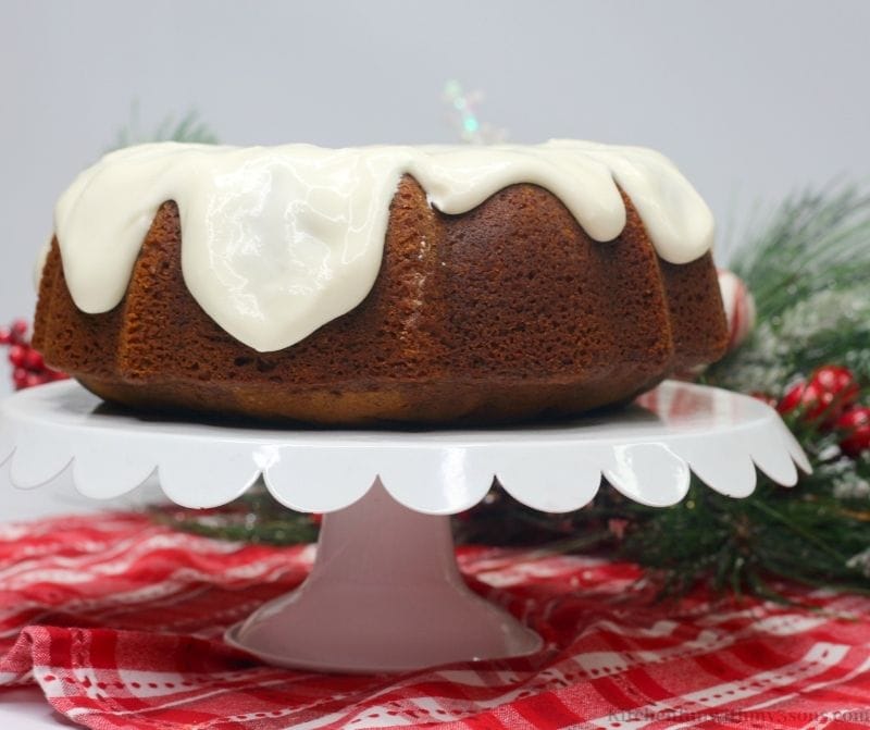 The Gingerbread Bundt Cake with branch directions behind it.