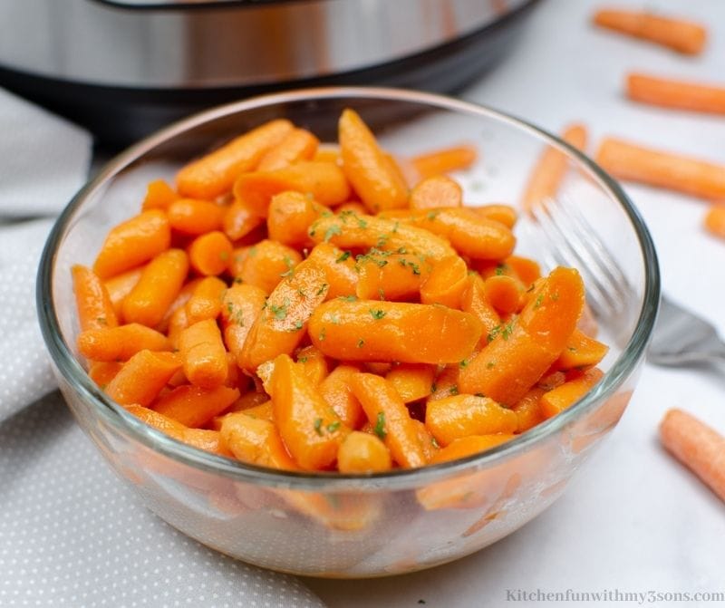 Glazed Carrots Recipe garnished with herbs.
