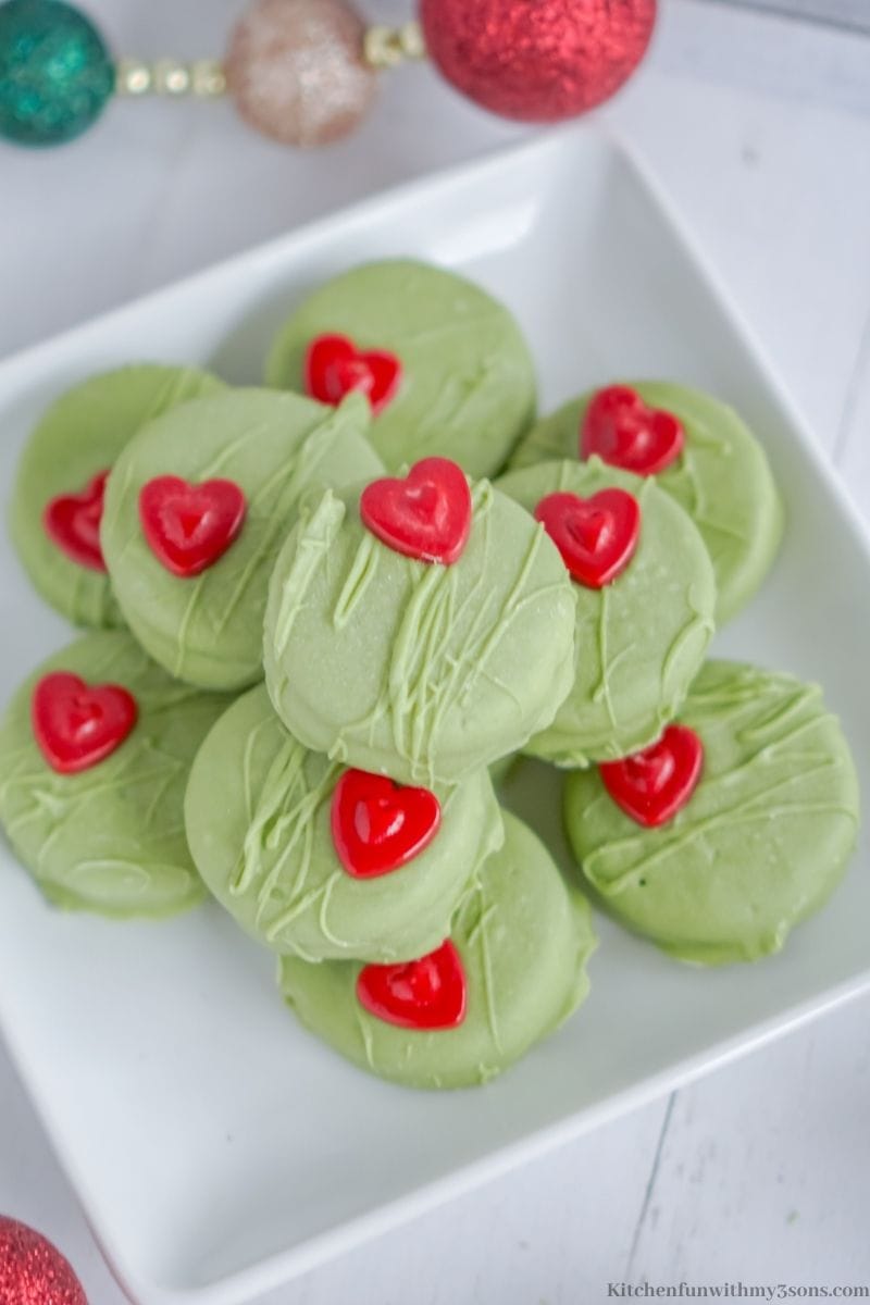 Grinch No Bake Cookies stacked on a serving platter.