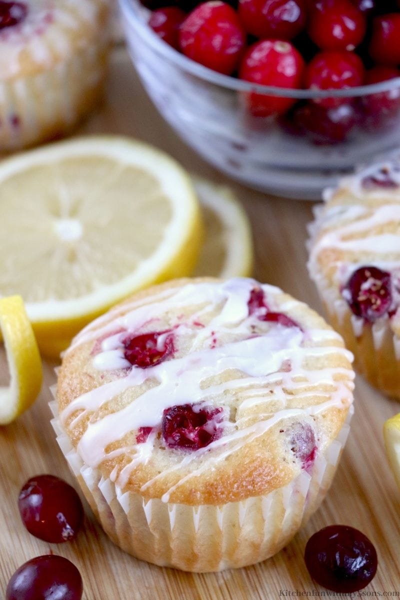 Lemon Cranberry Muffins Recipes on a wooden cutting board.