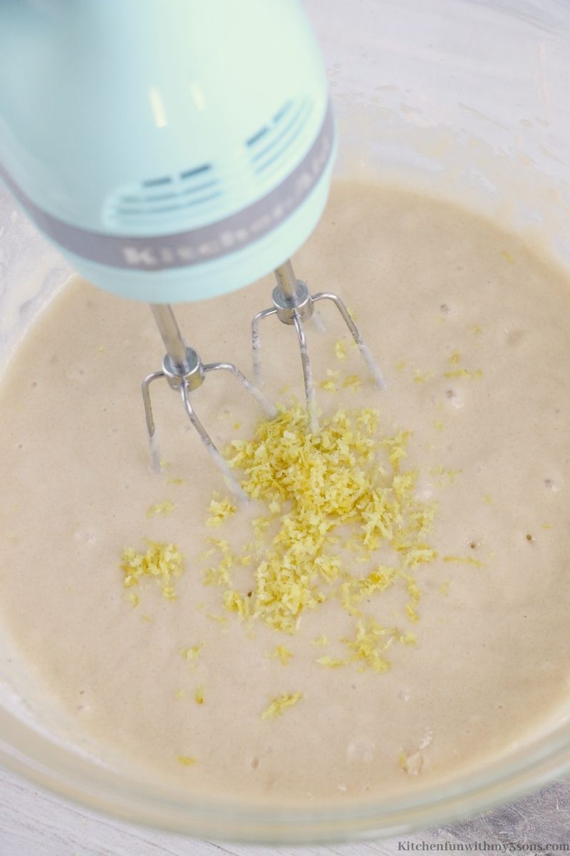 Adding in the lemon zest to your batter.