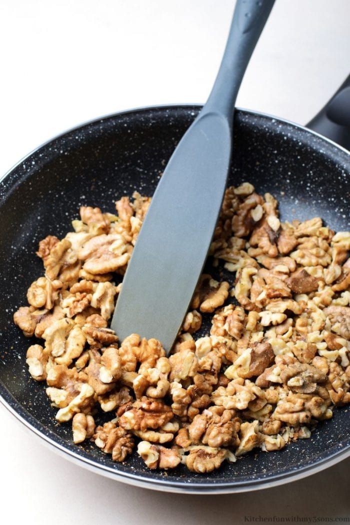 Stirring the walnuts in the pan
