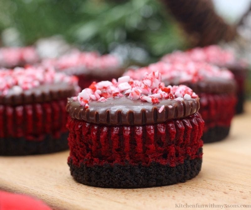 Mint Red Velvet Mini Cheesecakes garnished with crushed candy cane.