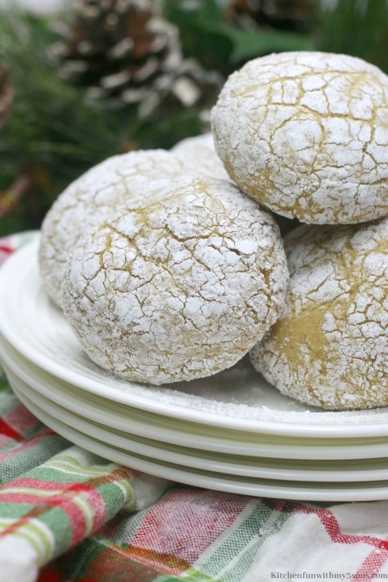 Pumpkin Spice Crinkle Cookies with tree decorations behind it with pine cones.