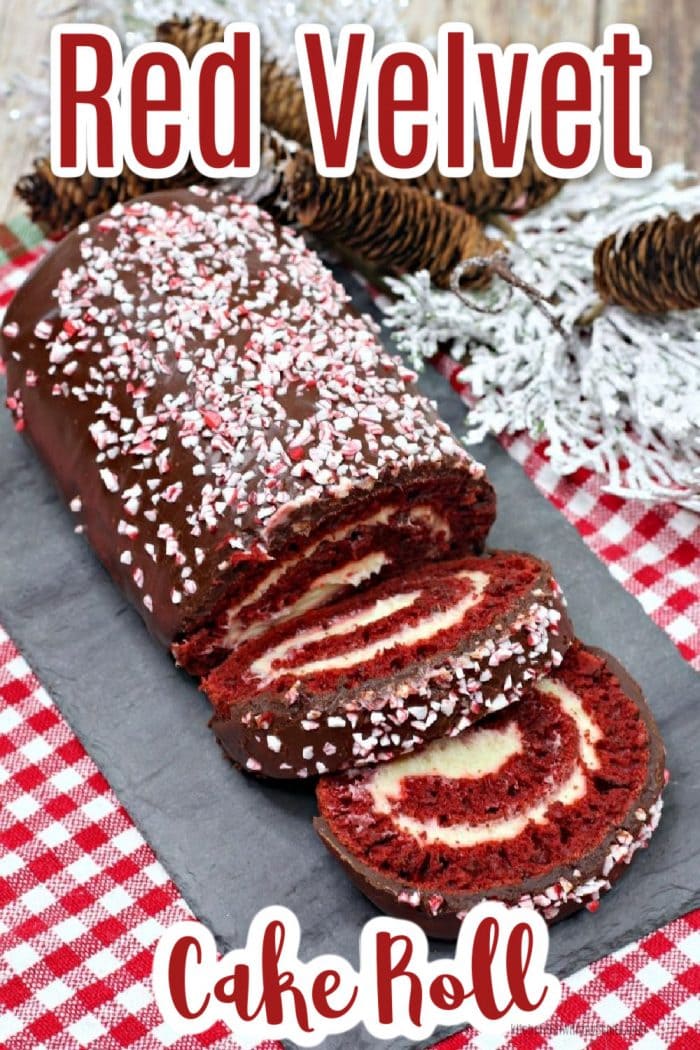 Red Velvet Cake Roll on a slate tray and peppermints crushed on top