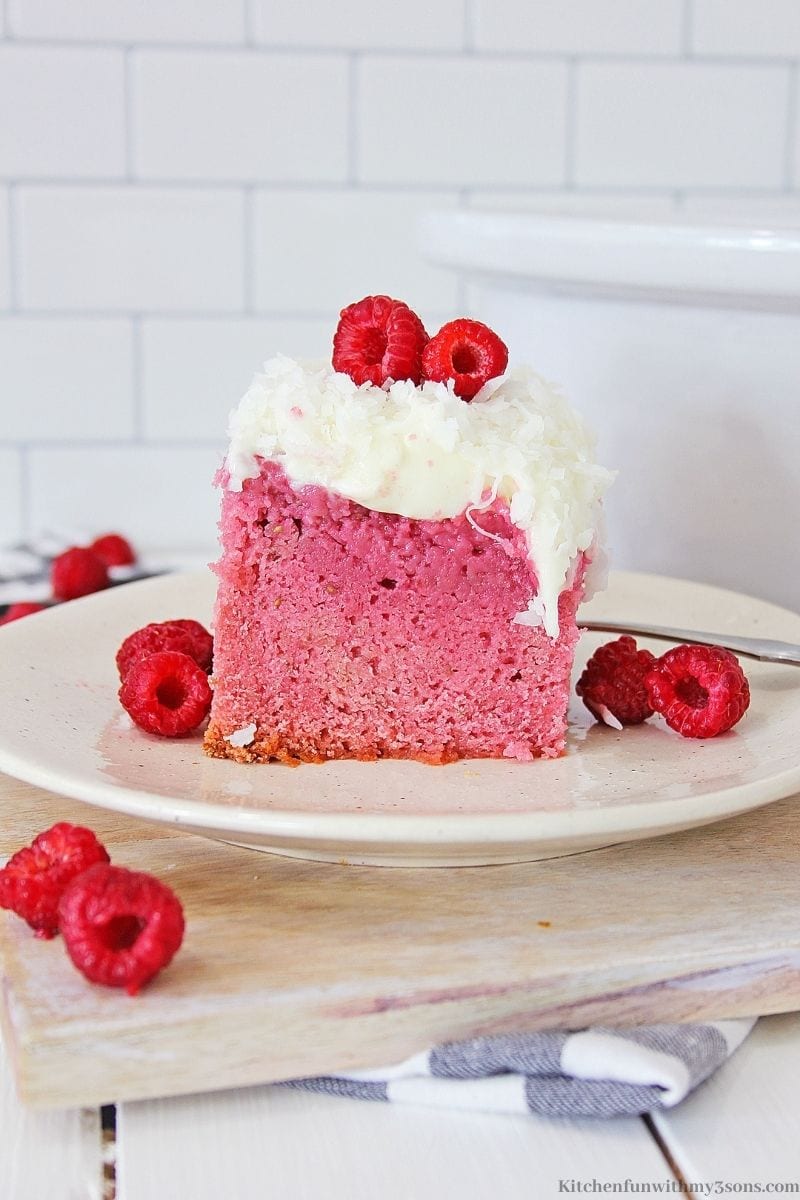 Slow Cooker Raspberry Zinger Cake with extra raspberries on top.