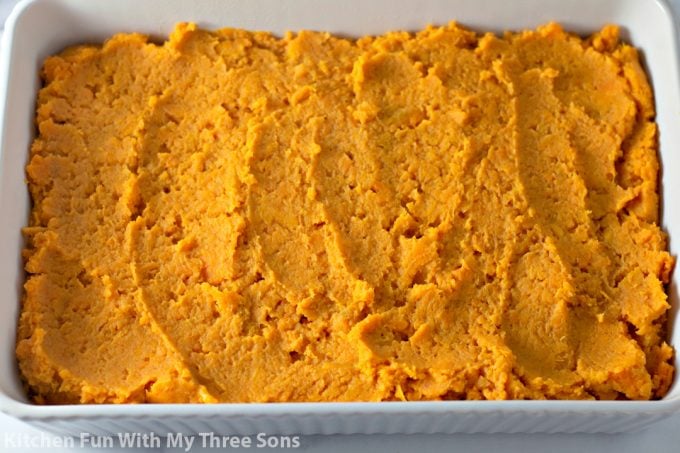 mashed sweet potatoes in a white casserole