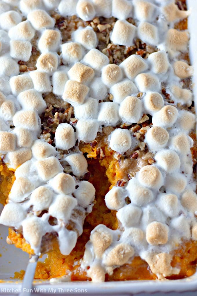 a spoonful of Sweet Potato Casserole with Pecan Streusel and Marshmallows