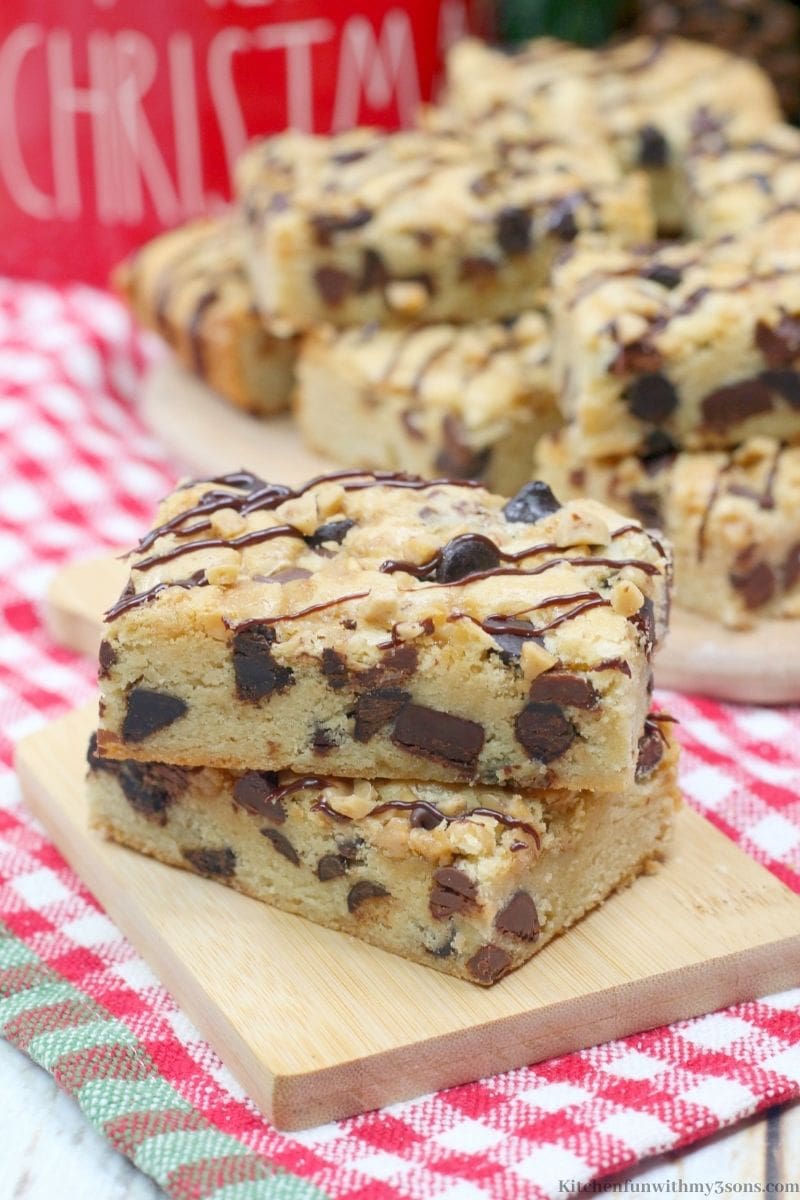 Toffee Cookie Bars on a wooden paddle.