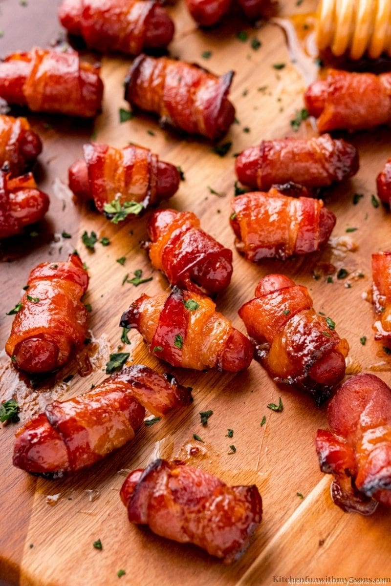 Bacon-Wrapped Smokies topped with parsley.
