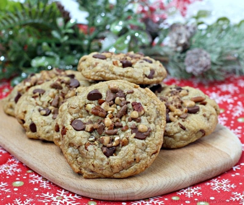 Chocolate Chip Pecan Toffee Cookies on a Christmas cloth.