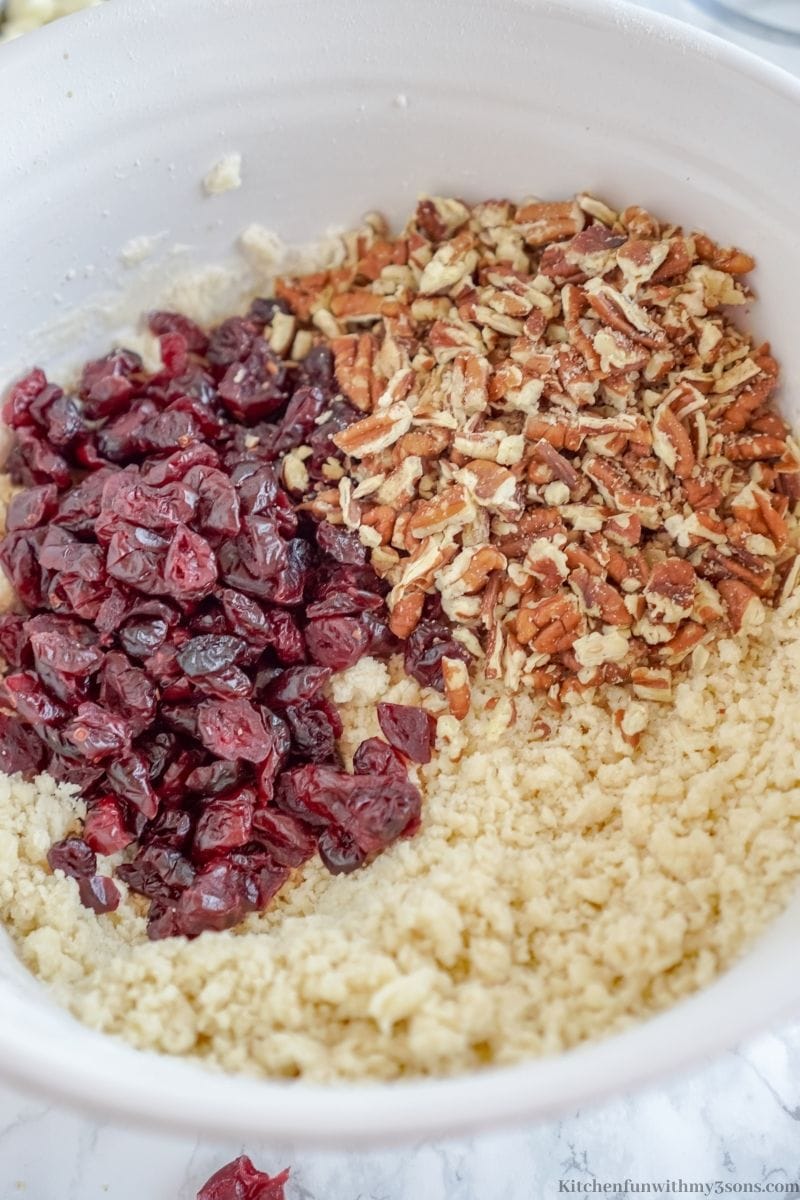 Adding in the pecans and cranberries.