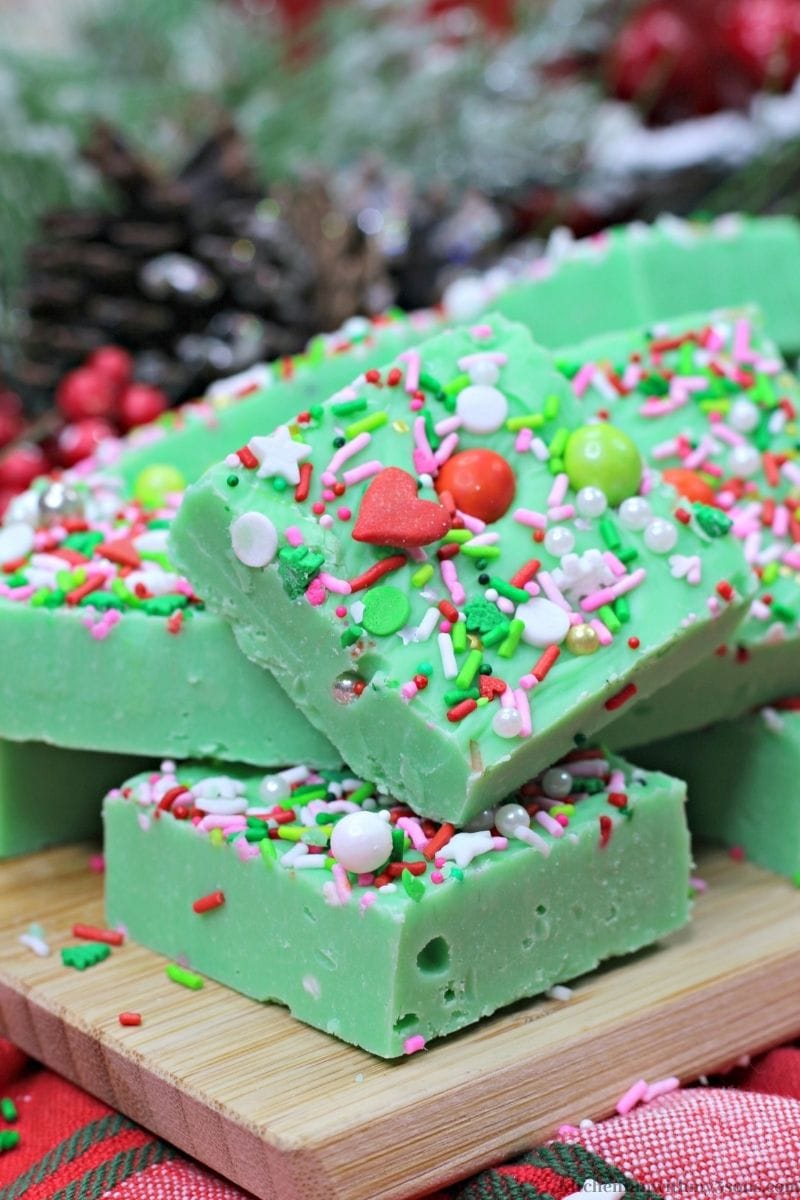Easy Holiday Grinch Fudge on a patterned cloth.