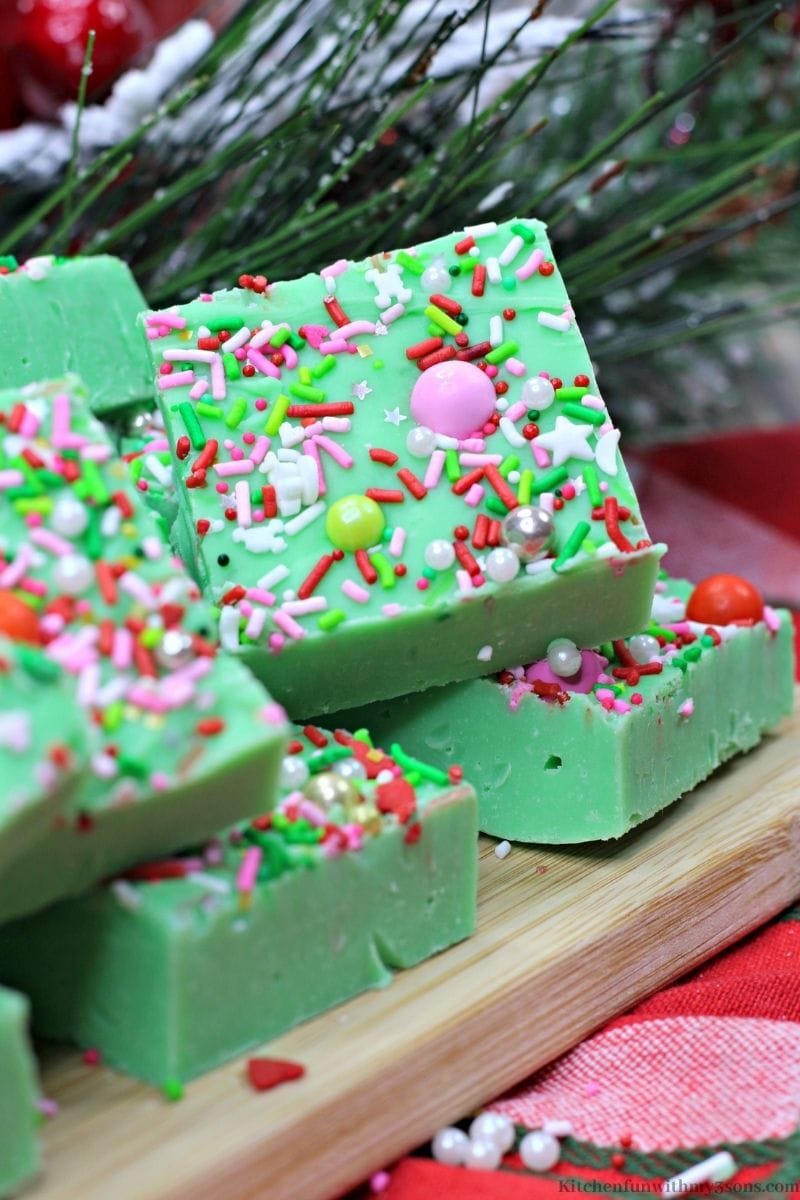 Easy Holiday Grinch Fudge with sprinkles all around.