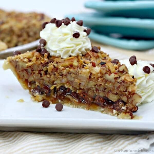 A single slice of German Chocolate Pecan Pie on a plate.