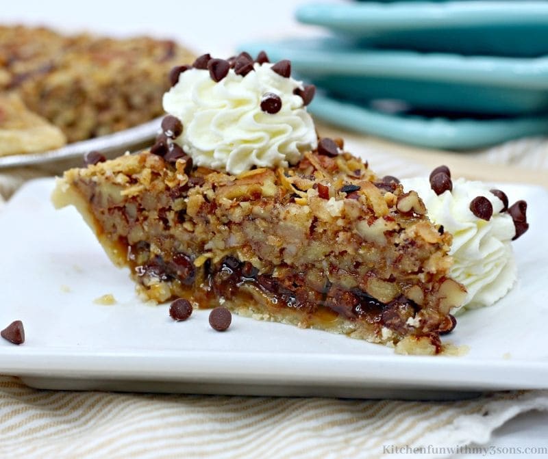 German Chocolate Pecan Pie on a white serving plate.
