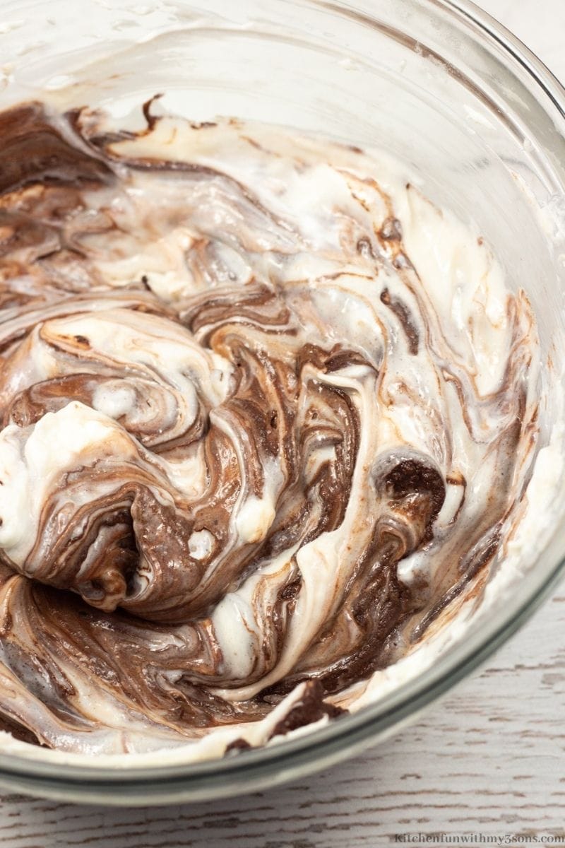 Mixing the chocolate layer ingredients together in a bowl.