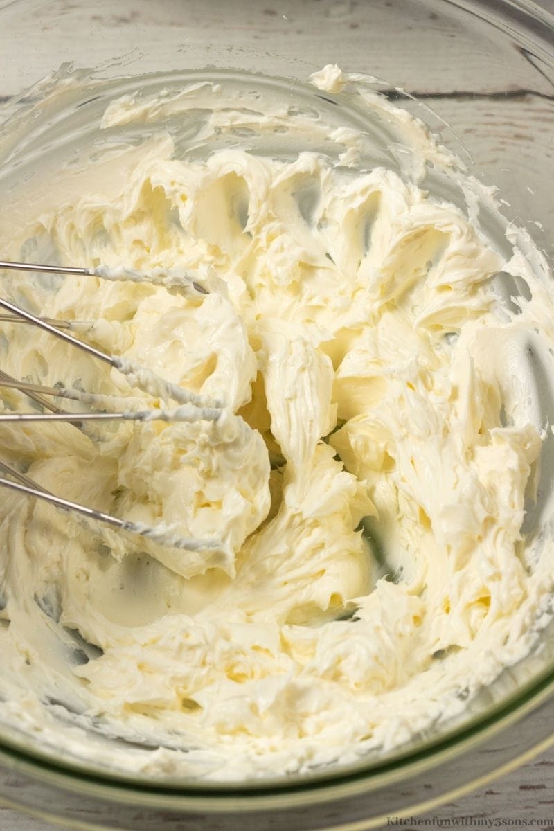 Mixing the frosting ingredients together in a bowl.