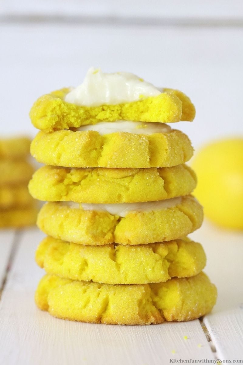 A stack of Lemon Cookies with Cream Cheese Frosting on a table