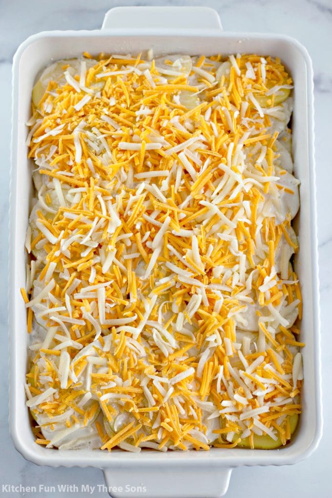 shredded cheese over the potatoes
