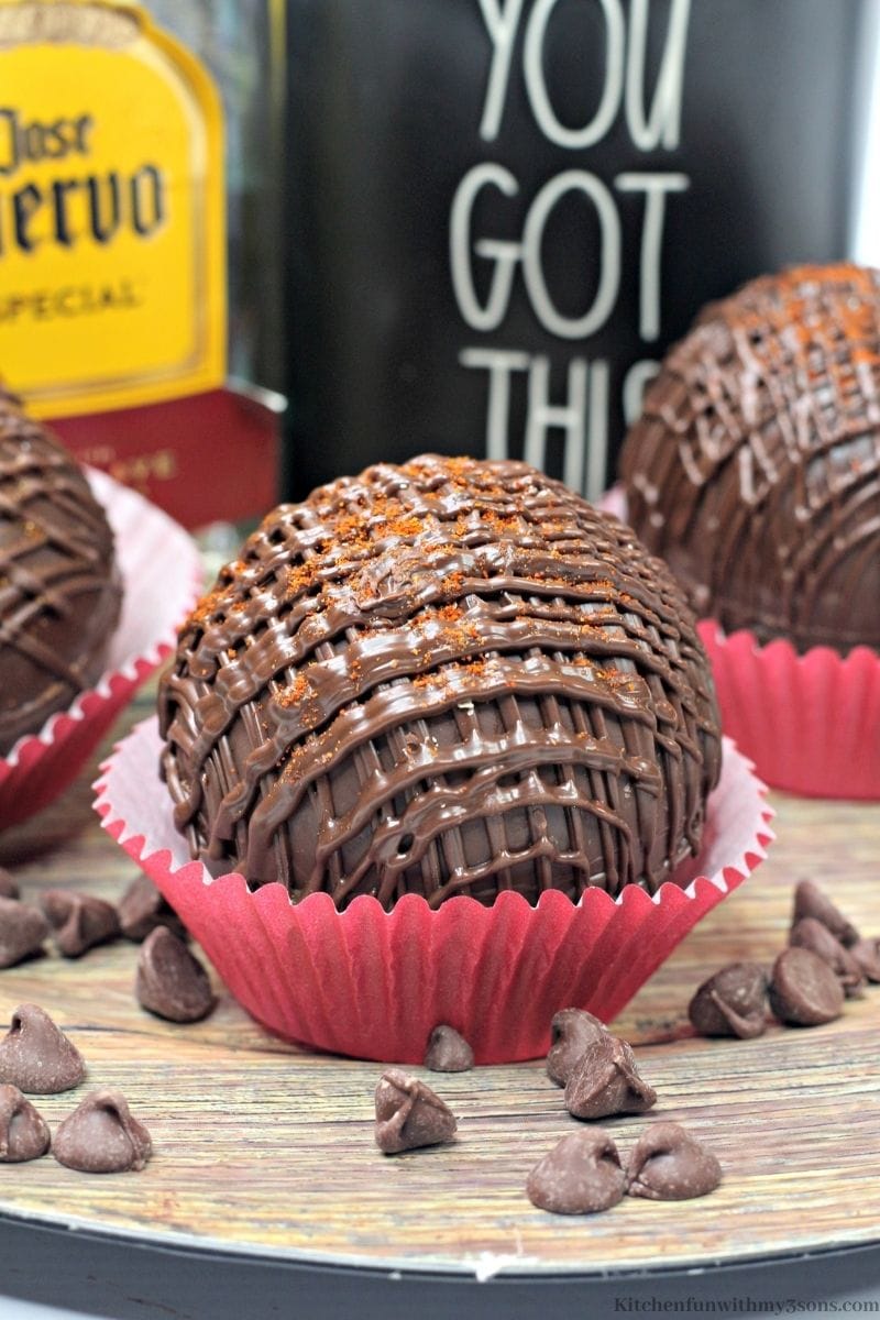 Mexican Hot Cocoa Tequila Bombs in red cupcake wrappers.